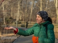 Bronx botanical garden, Woman feeding a bird out of her hand.